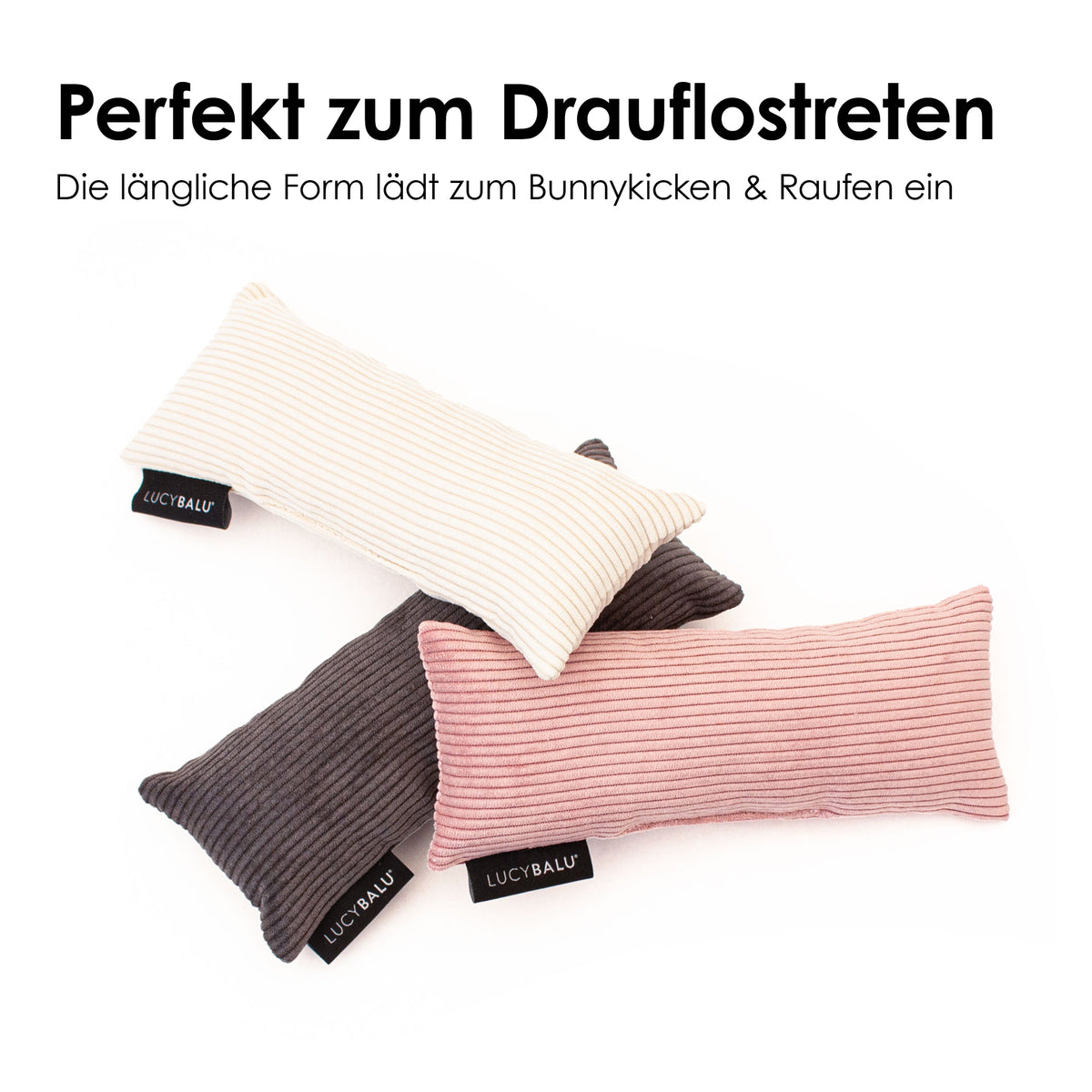 Drei längliche KICK BUNNY Kissen aus Cord in Rosa, Creme und Anthrazit mit LucyBalu Label