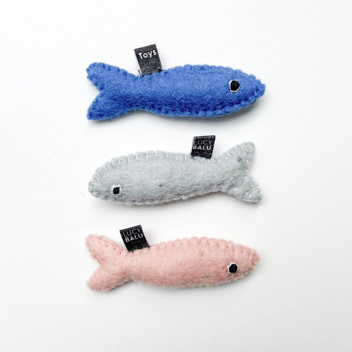 Giocattolo per gatti SARDINES in feltro di lana con erba gatta, set da 3 in grigio, rosa e blu